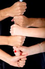 Hands making a tower isolated over a white background